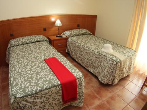 Giường trong phòng chung tại Nuevo Hostal Paulino