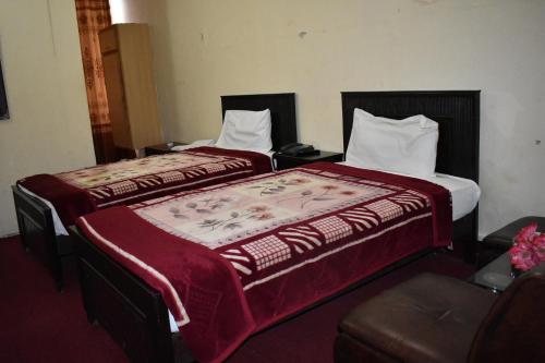 Vuode tai vuoteita majoituspaikassa Hotel Islamabad Residency
