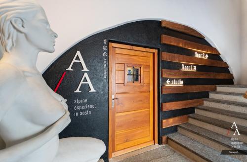 a entrance to a building with a door at Alp Apartments SKI & BIKE - Tourneuve5 in Aosta