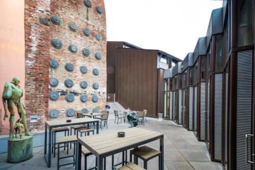 a row of tables and chairs in a building at Auberge de Jeunesse de Mons in Mons