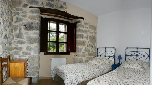 Tempat tidur dalam kamar di Playa La Franca apartamentos