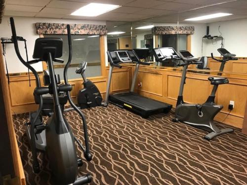 a gym with several exercise bikes and treadmills at Baymont by Wyndham Keystone Near Mt. Rushmore in Keystone