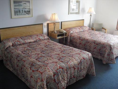 Ένα ή περισσότερα κρεβάτια σε δωμάτιο στο Auberge La Diligence