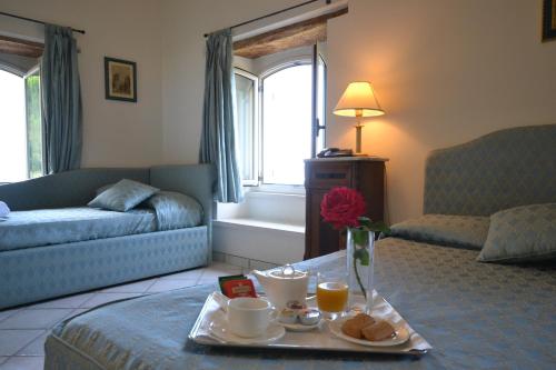 a living room with a table with a tray of food at Relais Villa Rossi in Silvi Marina
