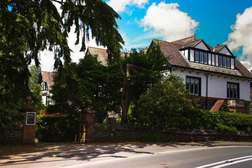 a house on the side of a road at Dene House Guest House in Bowness-on-Windermere