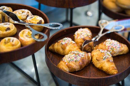 two baskets filled with different types of pastries and donuts at Vila Gale Collection Elvas in Elvas