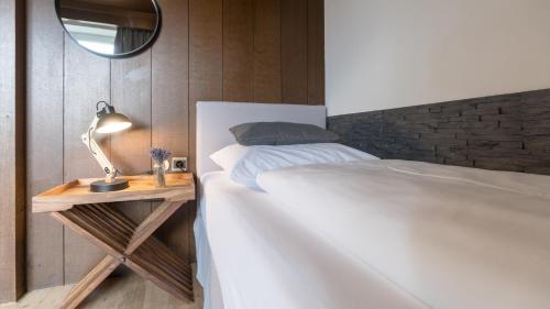 Katil atau katil-katil dalam bilik di Boutique Hotel Olympia