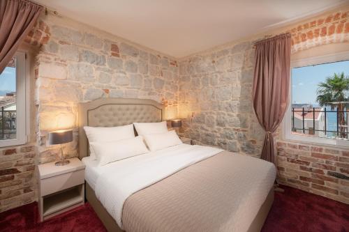 Ένα ή περισσότερα κρεβάτια σε δωμάτιο στο Hotel Agava Split