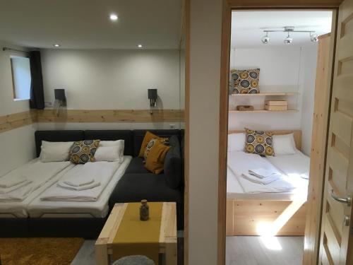 A bed or beds in a room at Modern Apartman Deluxe