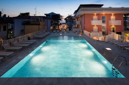 a swimming pool on the roof of a hotel at Hotel Villa Maria in Caorle