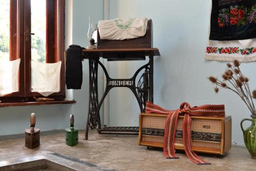 a living room with a table and a chair at Country house Dunjin Konak in Rogljevo