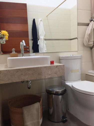 a bathroom with a sink and a toilet at Zen Home & Garden House in Cieneguilla