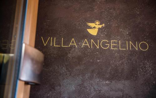 a book with the word villa angelina written on it at B&B Villa Angelino in Ortisei