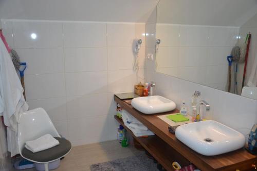 a bathroom with a sink and a toilet and a mirror at Apartament Czarna Góra Superior, Stronie Śląskie, Sienna, na Skarpie in Bystrzyca Kłodzka