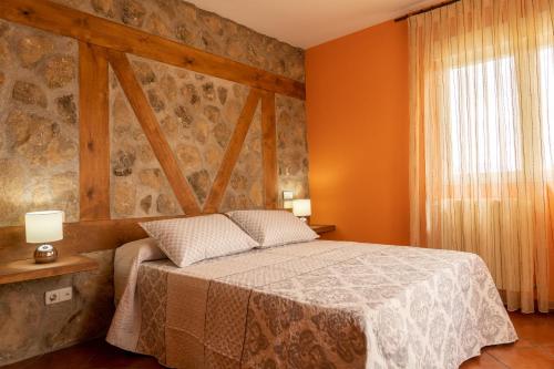 Postel nebo postele na pokoji v ubytování El Mirador de la Atalaya