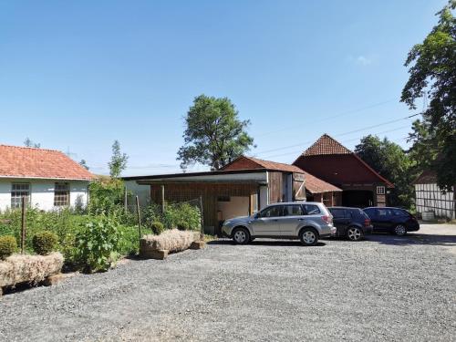 a car parked in a driveway in front of a house at Ferienhof Ehlers in Hülsede