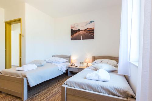 Posteľ alebo postele v izbe v ubytovaní Kelava Rooms