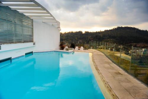 a swimming pool with a view of a mountain at Chilean Suites and Apartment in Santiago