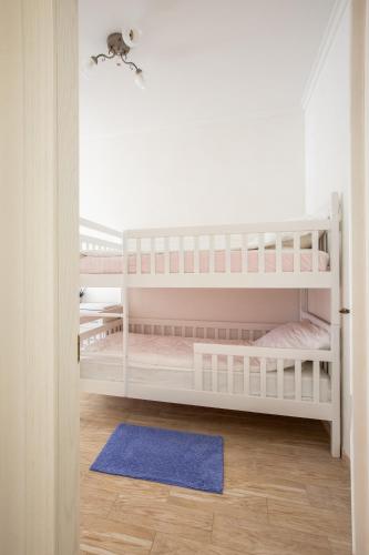 Ένα ή περισσότερα κρεβάτια σε δωμάτιο στο Apartament First Line