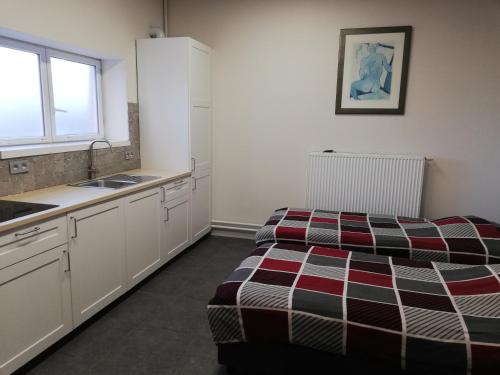 Postel nebo postele na pokoji v ubytování Lommel-inn