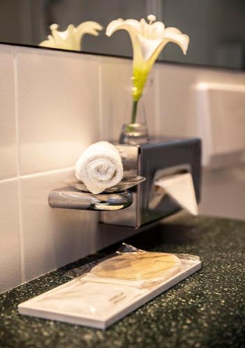 a towel is sitting on top of a machine at Hotel Burghof in Hof