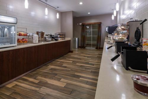 a fast food restaurant with a counter and a food at La Quinta by Wyndham Durango in Durango