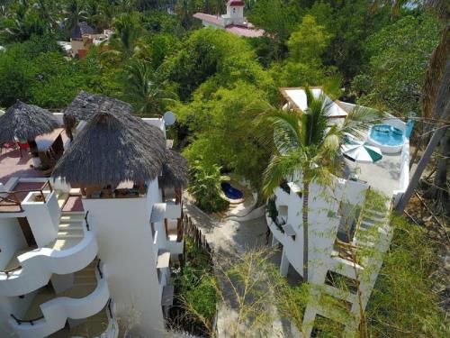 
a large building with a lot of trees on top of it at Mar y Sueños in Sayulita
