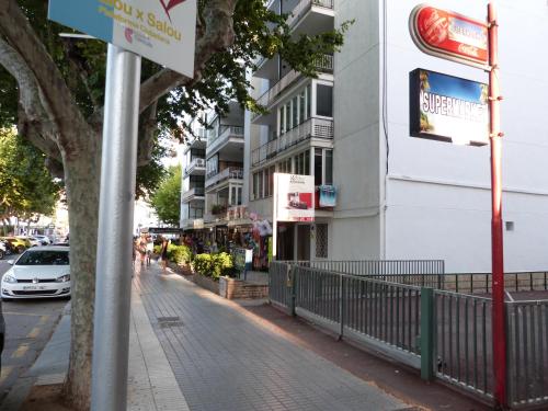 a street with a building and a car parked on a sidewalk at Lorena in Salou