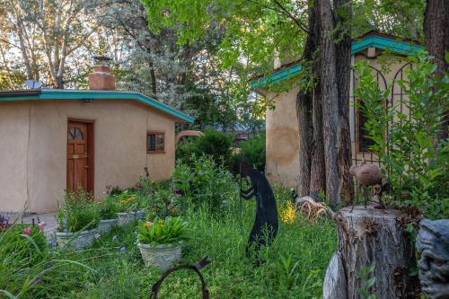 a small house in the middle of a garden at Dreamcatcher B&B in Taos