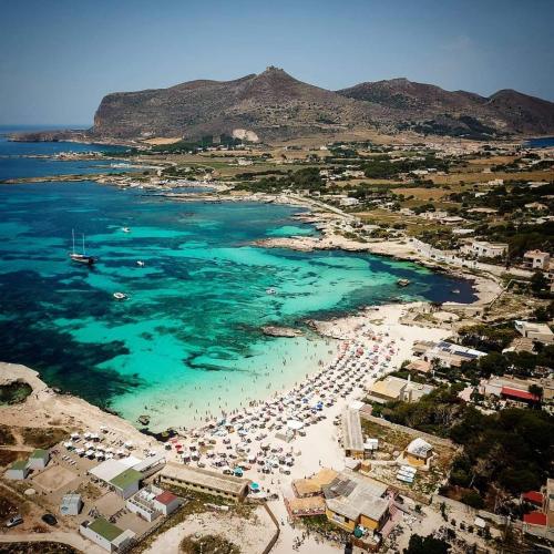 an aerial view of a beach with a group of people at Il Giardino su Lido Burrone in Favignana