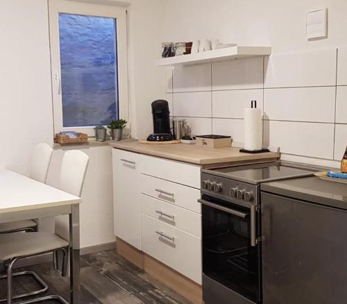 Kjøkken eller kjøkkenkrok på Ferienwohnung am Berg