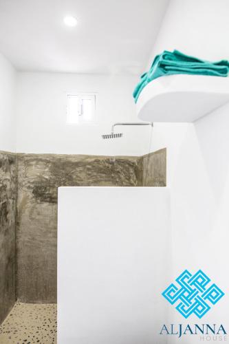 a room with a white counter and a sink at Aljanna House in Bacalar