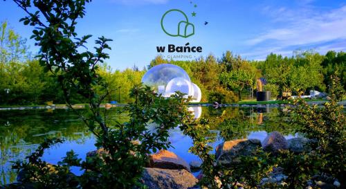 a view of a park with a bubble in the water at W BAŃCE Glamping in Łódź