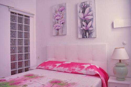 Кровать или кровати в номере Palmeras del Sur 1S
