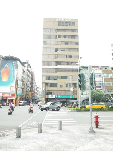 a city street with a traffic light and a building at Paper Plane Hostel in Kaohsiung