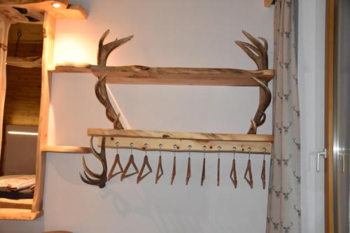 a rack of antlers hanging on a wall at Apartment Krobath in Murau