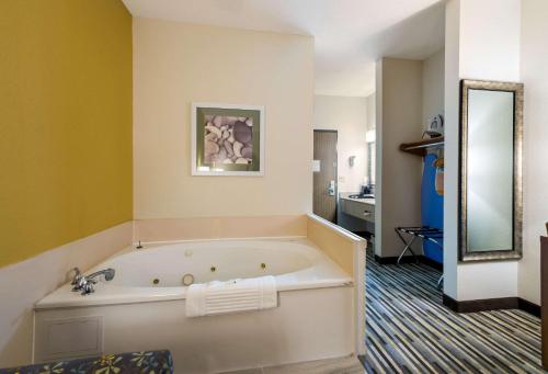 a bathroom with a large bath tub in a room at Quality Inn Michigan City South in Michigan City