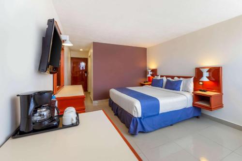 Katil atau katil-katil dalam bilik di Hotel Hostal de Cortés