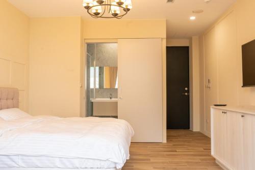 Ένα ή περισσότερα κρεβάτια σε δωμάτιο στο Grace Garden Coffee Homestay