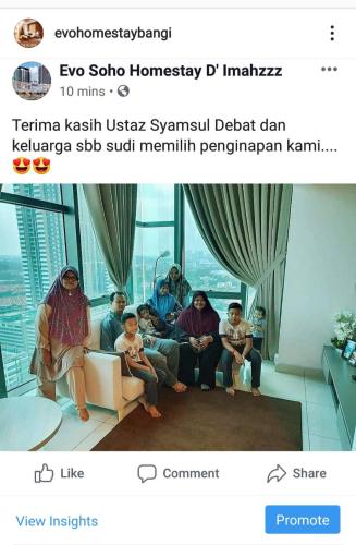 a group of people sitting in a living room at Evo Bangi Duplex Homestay D' Imahzzz - 3BR or 2BR in Bangi