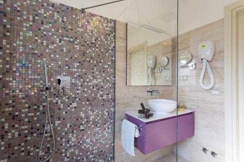 a bathroom with a sink and a shower at Domus Bellagio in Bellagio