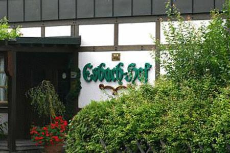 a building with a sign on the side of it at Hotel-Restaurant Esbach Hof in Kitzingen