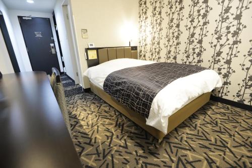 Voodi või voodid majutusasutuse APA Hotel Mie Kameyama toas