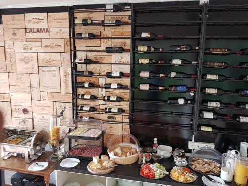 a kitchen with a counter with some food on it at Adriatic Apartment in Ulcinj