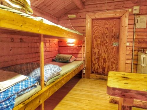 A bed or beds in a room at B&B Gillhov & Camping