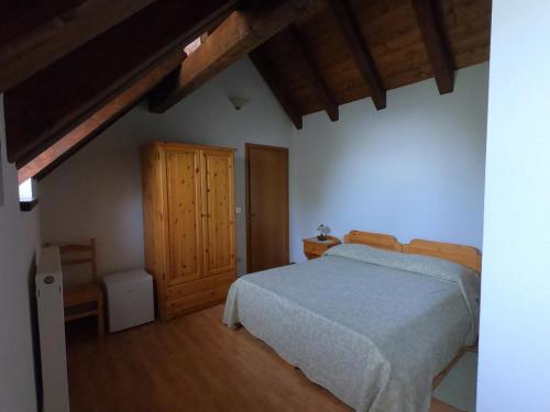 Tempat tidur dalam kamar di Agriturismo Bozica