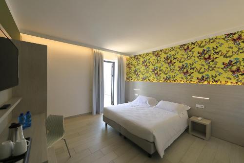 En eller flere senge i et værelse på Hotel San Marco