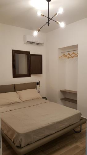 a bedroom with a bed and a ceiling fan at da Matilda in Agrigento