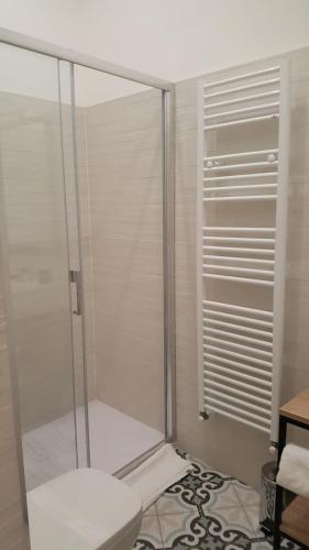 a shower stall in a bathroom with a toilet at da Matilda in Agrigento