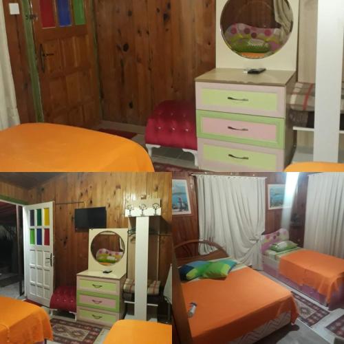 a room with two beds and a mirror at Side Tuana Garden Home in Side
